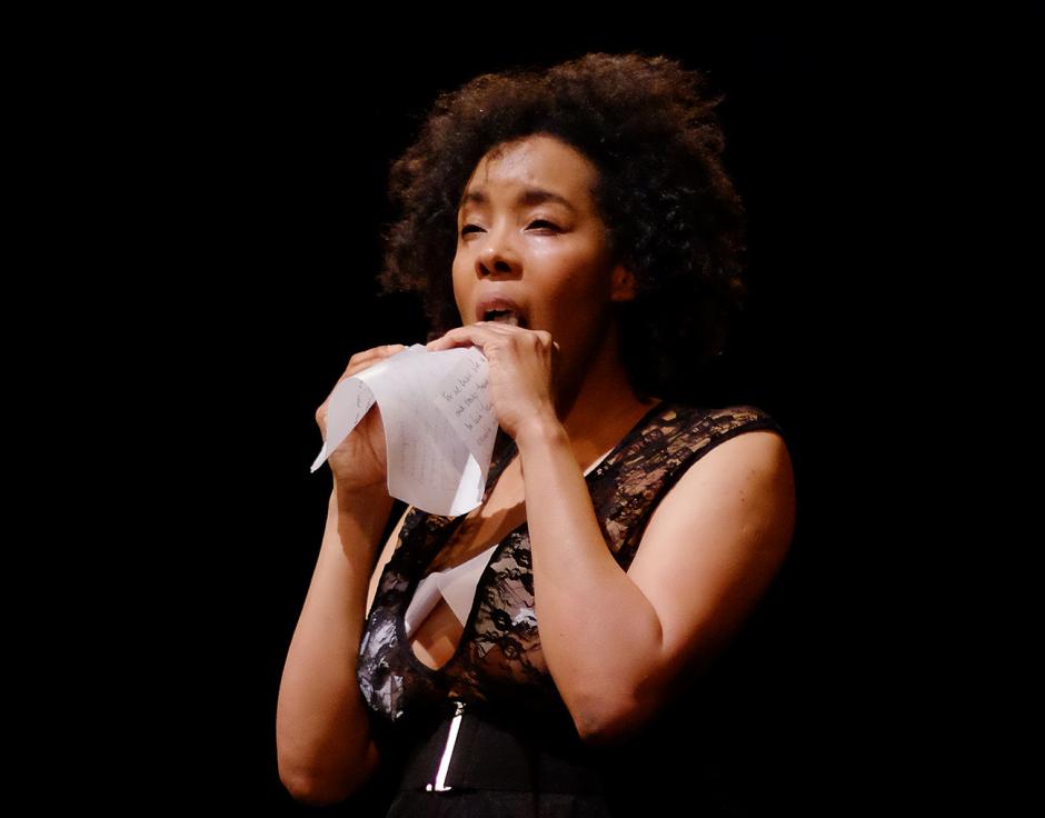 Elaine Mitchener eats part of the score for her Industrialising Intimacy performance piece, Oxford, 2015. Photo: ???